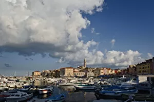 Images Dated 16th May 2007: Boats docked in harbor in front of distant Cathedral of St. Euphemia, Rovigno, Croatia