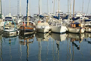 Boats and reflections in the marina area of Beaulieu sur Mer. on the coastline in