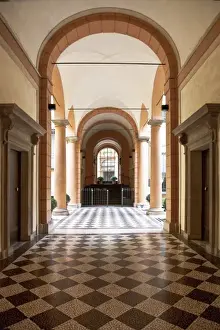 Emilia Romagna Prints: Bologna, Emilia-Romagna, Italy - An arched hallway with a diamond patterned floor
