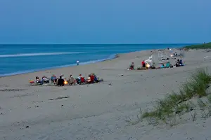 Images Dated 12th August 2015: Bonfires burn as night settles in on the beach at the Cape Cod National Seashore in Truro