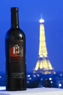 Images Dated 3rd May 2006: Bottle of Chapelle Lenclos against a dark blue sky background view over Paris with