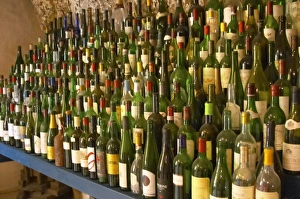 Emilion Prints: Many empty bottles in the tasting room Chateau Belair (Bel Air) 1st, premier Grand