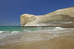 Dunedin Prints: Boy playing at Tunnel Beach, Dunedin, South Island, New Zealand (MR)