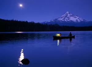 Images Dated 24th October 2005: Two boys in canoe with lantern at night on Lost Lake with Mt Hood in the background