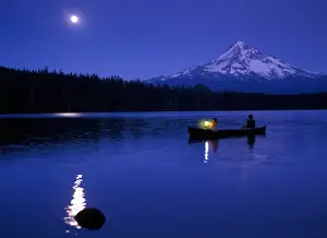 Images Dated 24th October 2005: Two boys in canoe with lantern at night on Lost Lake with Mt Hood in the background