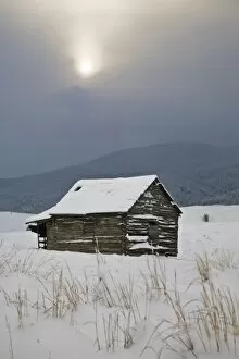 Bozeman, MT. An old barn sits quietly in a field amongst the freshly fallen snow