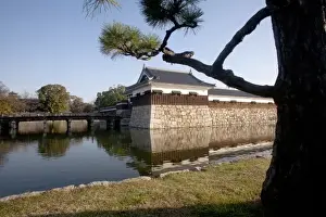 Ww Ii Prints: Branches frame moat and guard tower of the Hiroshima Castle grounds in central Hiroshima