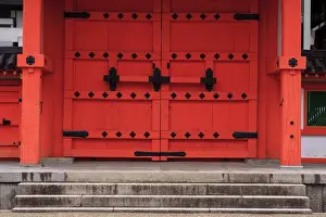 Kansai Prints: A bright red door in the grounds of the Sanjuusangendo Temple in Kyoto, Japan