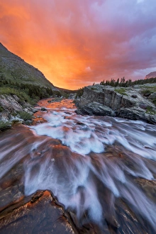 Images Dated 8th July 2016: Brlliant sunrise sky over Swiftcurrent Falls in Glacier National Park, Montana, USA