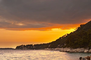 Images Dated 8th July 2006: The Brna bay at sunset, bright orange sky, sky reflected in the sea water. Holiday