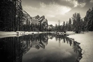 Snowy Prints: The Three Brothers above the Merced River in winter, Yosemite National Park, California