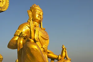 Golden Prints: Buddhist statue in Golden Temple, the largest Theravada Buddhist temple in Bangladesh