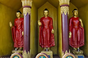 Buddhism Prints: Buddhist statues in Golden Temple, the largest Theravada Buddhist temple in Bangladesh