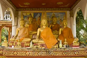 Vientiane Prints: Buddhist statues around Pha That Luang, (Great Stupa in Lao) is a Buddhist stupa
