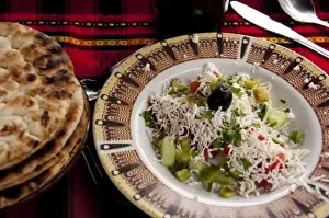 Feta Prints: Bulgaria, Veliko Tarnovo. Typical Bulgarian lunch of fresh vegetable salad topped feta cheese