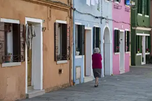 Carnival Prints: Burano and colorful buildings with elderly lady taking a walk