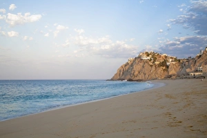 Cabo San Lucas, Baja California Sur, Mexico - A beach with natural rock formation in the distance