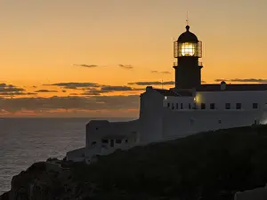 Portugal Prints: Cabo de Sao Vincente (Cape St. Vincent) with its lighthouse at the rocky coast of