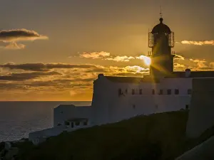 Portugal Prints: Cabo de Sao Vincente (Cape St. Vincent) with its lighthouse at the rocky coast of