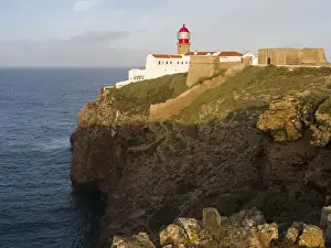 Portugal Prints: Cabo de Sao Vincente (Cape St. Vincent) with its lighthouse at the rocky coast of