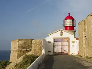 Portugal Prints: Cabo de Sao Vincente (Cape St. Vincent) with its lighthouse at the rocky coast of
