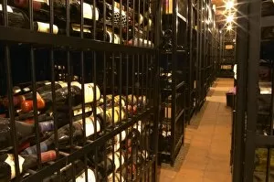 Cages with private wine collections at storage company Grappe where private individuals can store