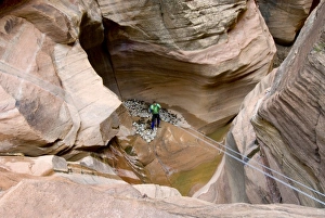 Cameron Carpenter straightening the rappel rope in Pine Creek Canyon, Zion National Park, Utah Cameron Carpenter straightening the rappel rope in Pine Creek Canyon, Zion National Park, Utah