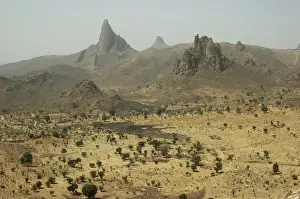 West Africa Prints: CAMEROON, Rhumsiki. Rocks rising in the middle of an arid landscape