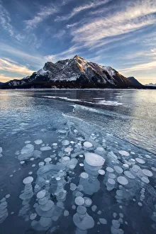 Ice Bubble Prints: Canada, Alberta, Abraham Lake. Ice bubbles in lake at sunset