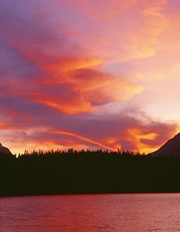 Canada, Alberta, Banff National Park, Flaming sunset over Mount Bosworth and Herbert Lake