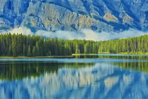 Canada, Alberta, Banff National Park. Reflection of Mt. Rundle in Two Jack Lake