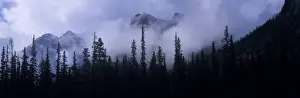 Mountainside Prints: Canada, Alberta, Banff NP. Clouds swirl around mountain peaks above Lake Louise Junction