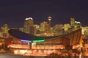 Sports Arena Prints: Canada, Alberta, Calgary: City Skyline from Ramsay Area / Evening with Saddledome