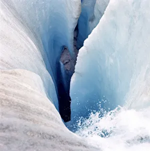 Images Dated 21st January 2014: Canada, Alberta, Columbia Icefields. Melting water flows beneath the Athabasca Glacier
