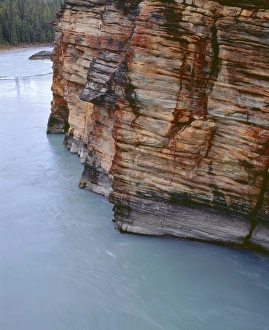 Canada, Alberta, Jasper National Park, Athabasca River flows alongside steep limestone