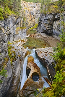 Images Dated 18th September 2011: Canada, Alberta, Jasper National Park. Maligne River flows down Maligne Canyon. Credit as