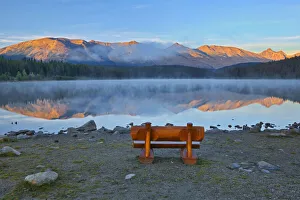 Away From It All Prints: Canada, Alberta, Jasper National Park. Bench overlooking lake and mountains at sunset