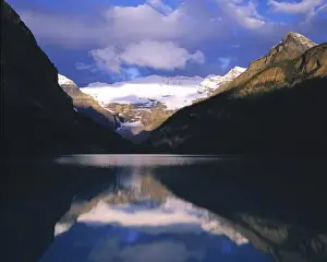 Canada, Alberta, Lake Louise. Dawn light hits Victoria Glacier and Lake Louise in Banff NP