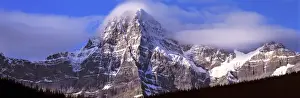 Banff Prints: Canada, Alberta, Mt. Chephren. Mount Chephren wears a mantle of clouds in Banff NP
