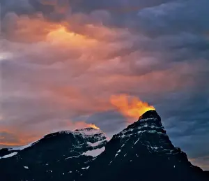 Fiery Prints: Canada, Alberta, Mt. Chephren. A snow plume catches light from the setting sun on Mt