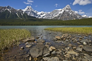 Melt Prints: Canada, Alberta, Rocky Mountains, Banff National Park, lake fed by snowmelt in creek