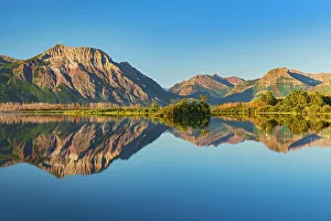Prints of Canada, Alberta, Waterton Lakes National Park. Canadian Rocky Mountains reflected in Lower Waterton Lake Images Dated 2022 December: Canada, Alberta, Waterton Lakes National Park