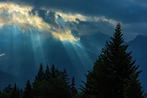 Sunburst Prints: Canada, Alberta, Waterton Lakes National Park. Sunburst through storm clouds