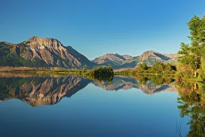 Prints of Canada, Alberta, Waterton Lakes National Park. Canadian Rocky Mountains reflected in Lower Waterton Lake Images Dated 2022 December: Canada, Alberta, Waterton Lakes National Park