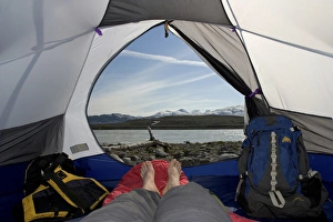Feet Prints: Canada, British Columbia, Alsek River Valley. View of Alsek River from inside camp tent