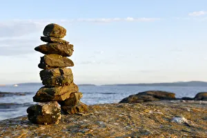 Russell Island Prints: Canada, British Columbia, Russell Island. Rock inukshuk in front of Salt Spring Island