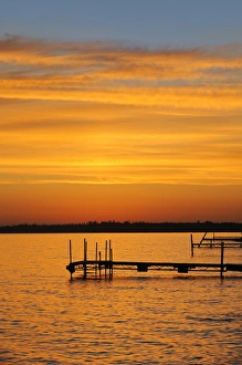 Canada, Manitoba, Clearwater Lake Provincial Park. Docks on Clearwater Lake at sunrise