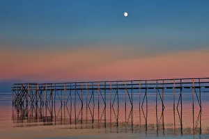 Manitoba Prints: Canada, Manitoba, Matlock. Pier on Lake Winnipeg at dusk with moon