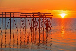 Canada, Manitoba, Matlock. Pier at sunrise on Lake Winnipeg