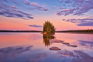 Outcrop Prints: Canada, Manitoba, Paint Lake Provincial Park. Island on Paint Lake at sunrise